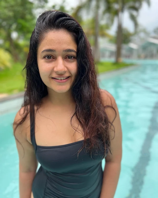 Poonam Bajwa black swimsuit curvy figure south indian actress