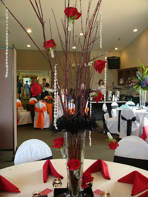 Tall centerpiece composed of birch branches surrounded by euphorbia