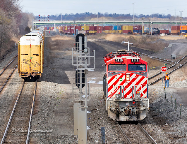 CN 3115 and CN 2830 have cut off lite from Q212-22 and are entering DeWitt Yard on the Departure lead