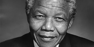 Under the system of Apartheid, in an effort to free his country, America and Britain put Nelson Mandela behind bars for 27 suffering years.