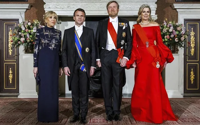 Queen Maxima wore a new red satin dress by Claes Iversen. President Emmanuel Macron and Brigitte Macron