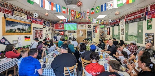 The small restaurant is at capacity during the match, with diners finishing meals in the first half