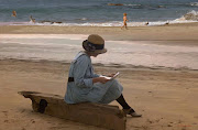 Lady reading a love letter on the beach. (reading letter on the beach rtp)
