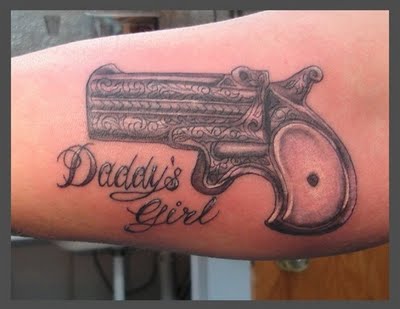 gun tattoos on hips pictures