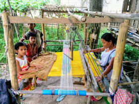 Mekhla and Chadar being woven by Mishing tribal women, Assam