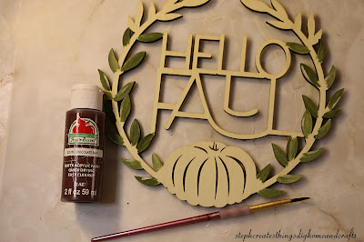 Acrylic paint, hello fall sign with painted leaves and paintbrush