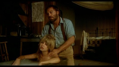 Jess (Stacy Keach) helps Kady (Pia Zadora) with her bath