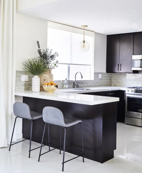 black-kitchen-cabinets-with-white-quartz-countertops