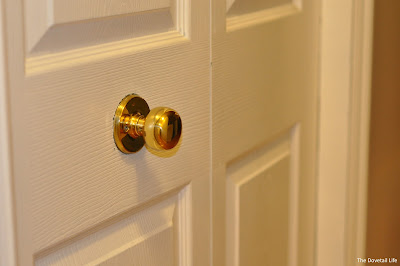 A brass doorknob on our closet