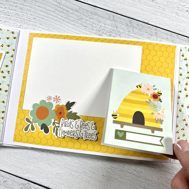 spring memories scrapbook album page with flip-up card and beehive