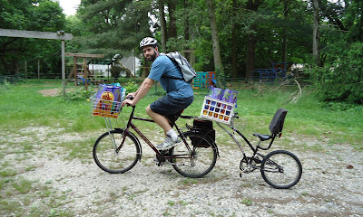 image of Chris riding home laden with shopping