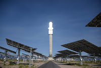 Large tracking mirrors, called heliostats, follow the sun throughout the day, reflecting and concentrating sunlight onto the top of Crescent Dunes' central tower. (Credit: SolarReserve) Click to Enlarge.