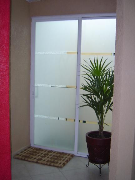 Instalacion de puerta de vidrio en Guadalajara PGINAS