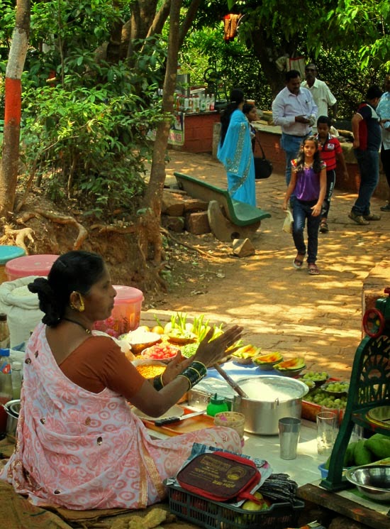 Woman vendor selling drinks and snacks