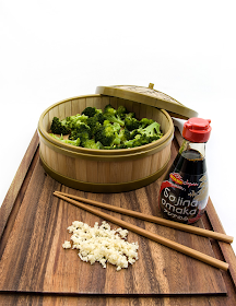 Broccoli with garlic sauce on table