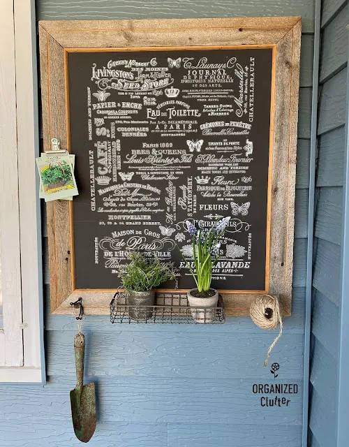 Photo of framed chalkboard botanical themed wall decor.