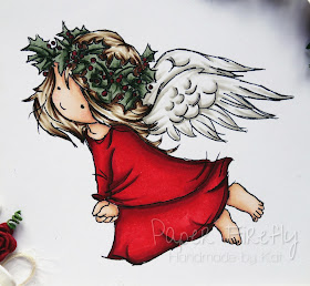 Christmas angel in traditional red and green (image from LOTV)