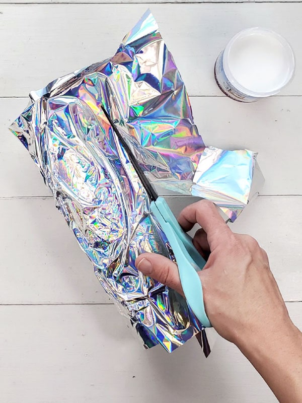 Continue to paint Ultra Seal, scrunch the iridescent wrapping and wrap the tumbler in the iridescent finish. It already looks so fun and shiny!
