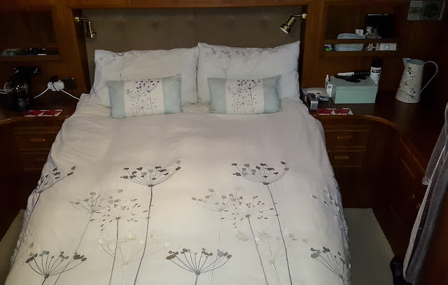 Photo of our comfy bed in which we are frequently rocked to sleep