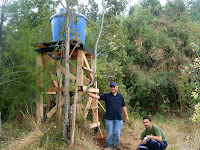 Chayito laughs as the final connections are placed between the tower and the cabin