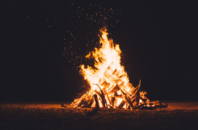 A blazing orange campfire