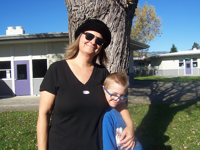 Photo of Lisa Nolan of Confessions of a Montessori Mom with her tween-age son by tree