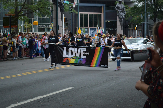 Pride sign with the word love in rainbow colors.