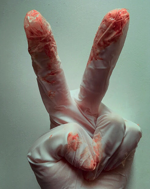 Blood-spattered white glove (bloody V sign)