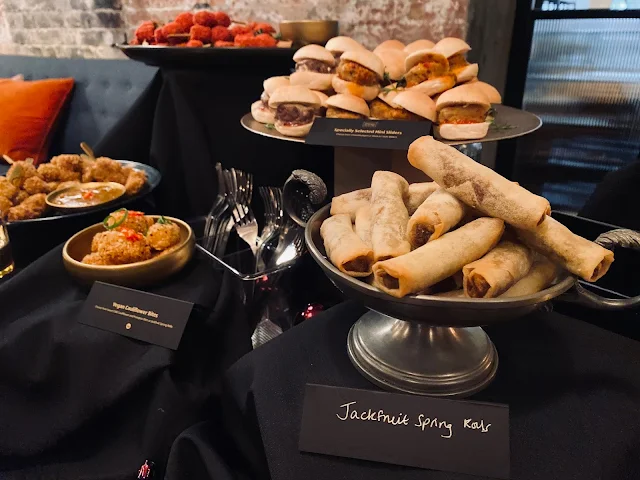 Some of the Vegan Aldi Christmas party food range  including jackfruit spring rolls and cauliflower bites