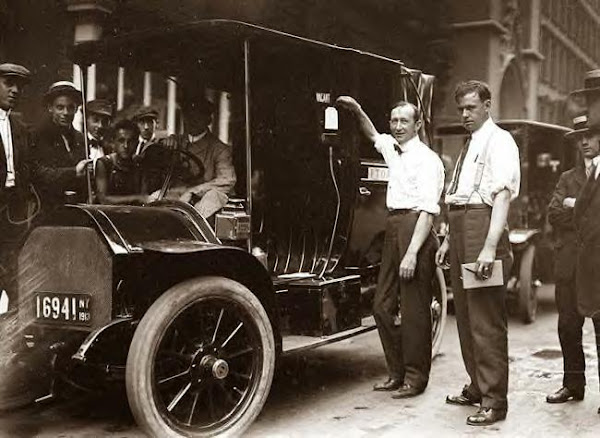 Inspector Walsh condemning NYC taxicab. 1913