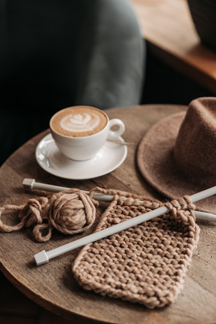 Photo by Pavel Danilyuk: https://www.pexels.com/photo/coffee-drink-beside-a-knitted-material-on-wooden-table-5788198/