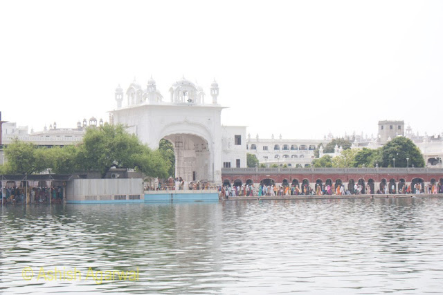 View of one of the entrances to the Golden Temple compound along with a number of devotees in the city of Amritsar