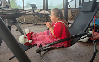 Eating a doughnut on the rocking chair