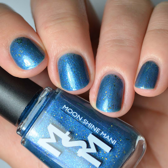 smoky blue nail polish with color shifting flakies swatch