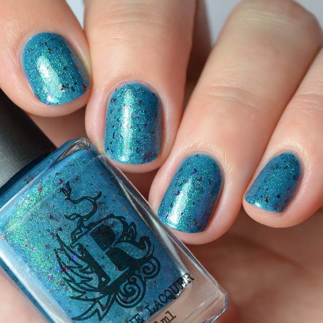 blue shimmer nail polish with flakies