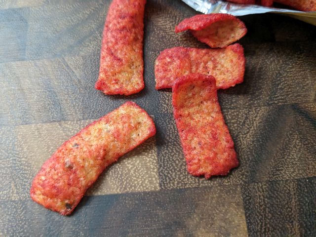 Flamin' Hot Bar-B-Q Fritos corn chips close-up.