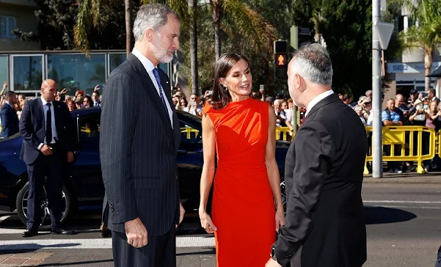 Queen Letizia wore a red orange gathered midi dress made of wool blend fabric by ZARA x Narciso Rodriguez