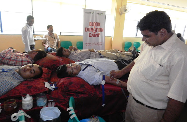 Volunteers donating blood during Blood Donation Camp organised by Connect Broadband on the occasion of Raksha Bandhan_1-min