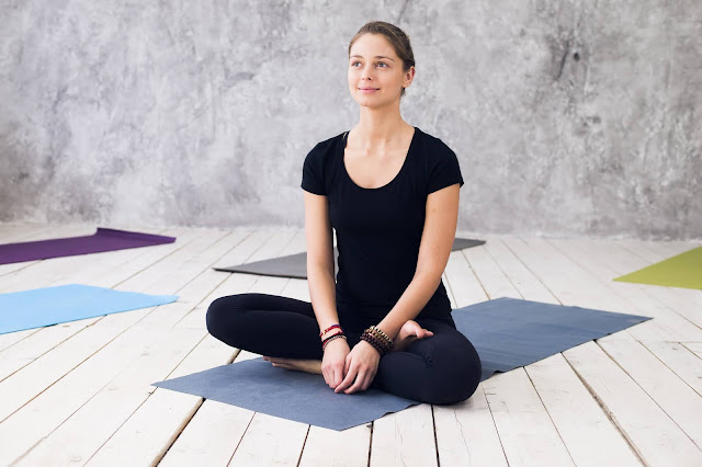 Just For Today Meditation - Woman practicing meditation at a yoga studio