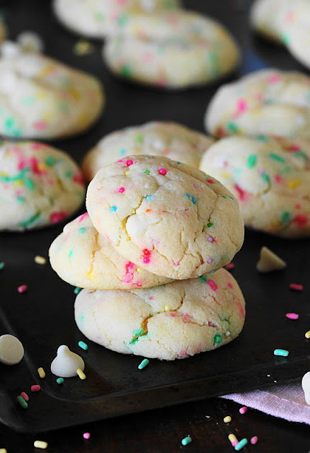 Stack of White Chocolate Funfetti Cake Mix Cookies with Spring Colored Sprinkles Image