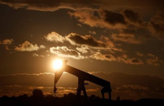 An oil pump jack is seen at sunset in a field outside Scheibenhard, near Strasbourg, France, October 6, 2017. (Credit: Reuters/Christian Hartmann) Click to Enlarge.