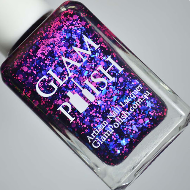 blue nail polish with glitter in a bottle