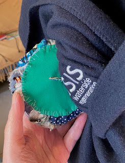 back of crazy quilt button showing rough stitching