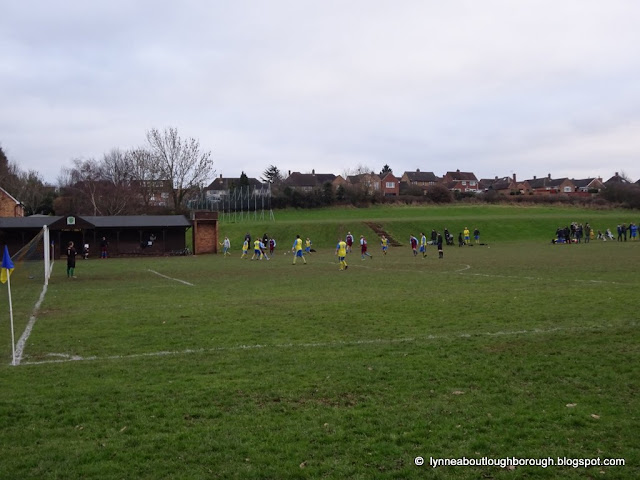 People playing football on grass