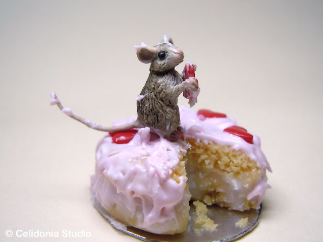 miniature mouse on cake