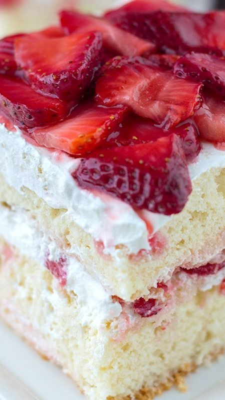Strawberry Shortcake. Classic vanilla cake layered with strawberries. Family favorite summer dessert recipe. #cake #dessert