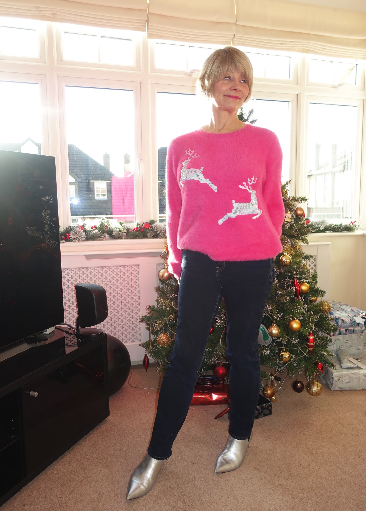 Is This Mutton blogger Gail Hanlon in pink jumper with silver reindeer for Christmas 2020