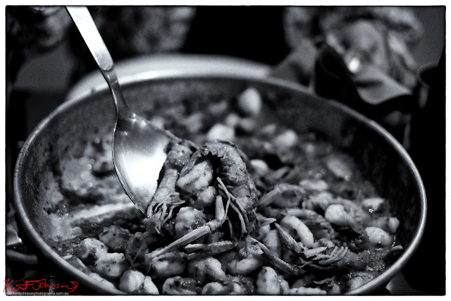 Serving from our pan of scampi gnocchi at Trattoria Da Oscar Monterosso al Mar. Photo by Kent Johnson