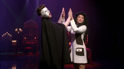 Kurt dressed as the Phantom of the Opera, dancing with Tina dressed as Christine