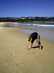 Alex writing Haydn on the beach